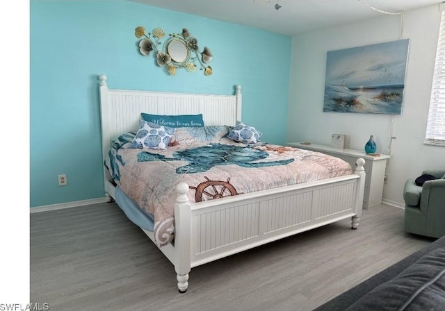 7330 Estero Blvd Unit 1107, Fort Myers Beach, FL 33931 - bedroom with wood finished floors and baseboards