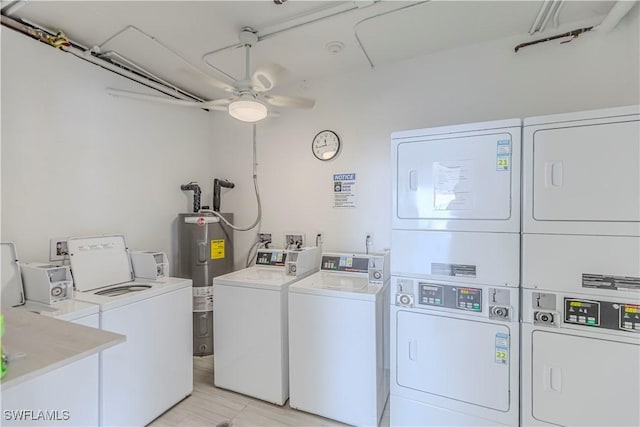 7330 Estero Blvd Unit 1107, Fort Myers Beach, FL 33931 - community laundry featuring washer and clothes dryer, stacked washer and clothes dryer, electric water heater, and ceiling fan