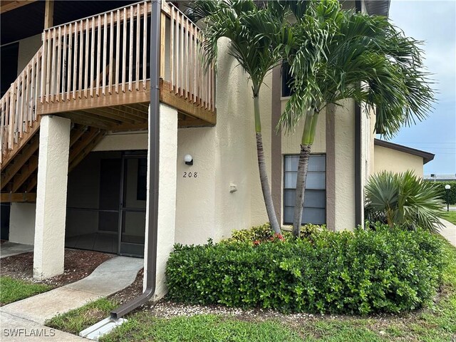 13118 Feather Sound Dr Unit 208, Fort Myers, FL 33919 - property entrance featuring stucco siding