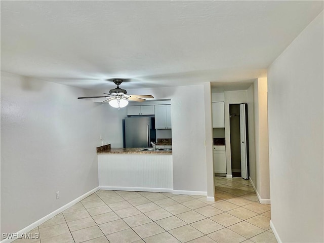 13118 Feather Sound Dr Unit 208, Fort Myers, FL 33919 - unfurnished living room featuring light tile patterned flooring and ceiling fan