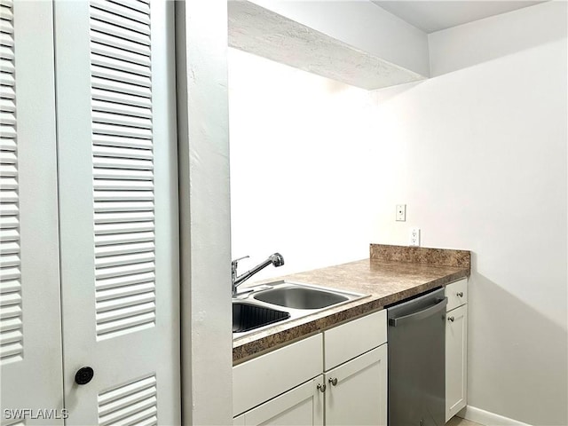 13118 Feather Sound Dr Unit 208, Fort Myers, FL 33919 - kitchen with dishwasher, white cabinetry, and dark countertops