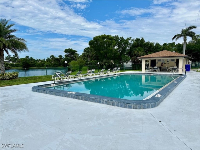 13118 Feather Sound Dr Unit 208, Fort Myers, FL 33919 - community pool with a patio area, a water view, and view of scattered trees