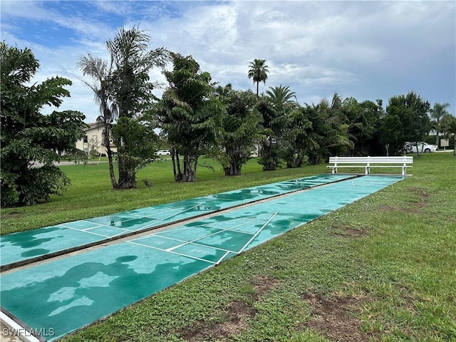 13118 Feather Sound Dr Unit 208, Fort Myers, FL 33919 - view of community featuring a yard and shuffleboard