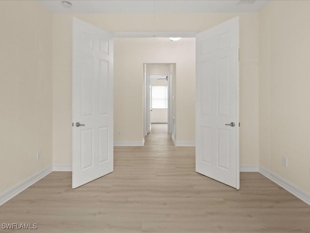 6491 Marbella Dr, Naples, FL 34105 - empty room with light wood-style flooring and baseboards