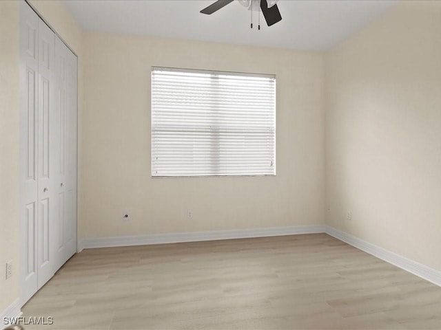6491 Marbella Dr, Naples, FL 34105 - unfurnished bedroom with light wood-style flooring, a closet, and ceiling fan