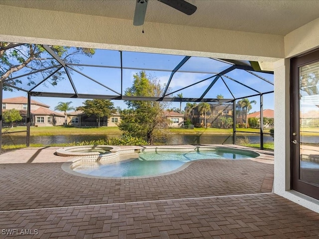 6491 Marbella Dr, Naples, FL 34105 - view of pool featuring a patio area, a ceiling fan, glass enclosure, and a water view