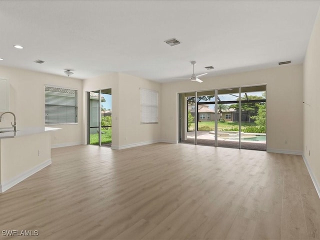 6491 Marbella Dr, Naples, FL 34105 - unfurnished living room featuring ceiling fan, light wood-style flooring, and recessed lighting