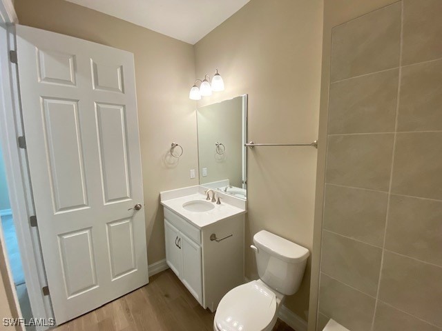 1023 Enbrook Loop, Naples, FL 34114 - bathroom with vanity and wood finished floors