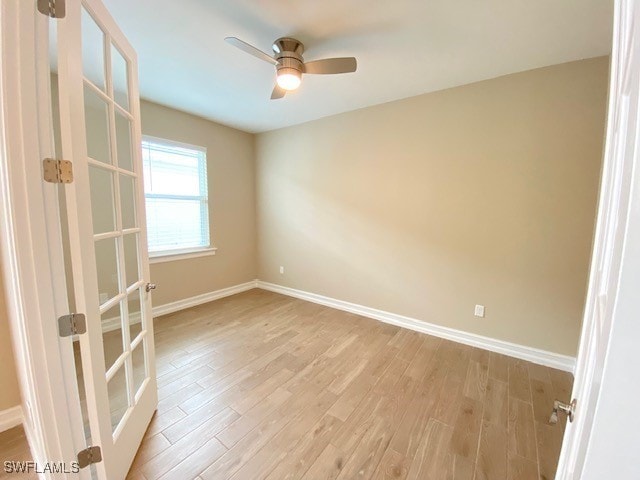1023 Enbrook Loop, Naples, FL 34114 - spare room featuring light wood-style flooring, ceiling fan, and french doors