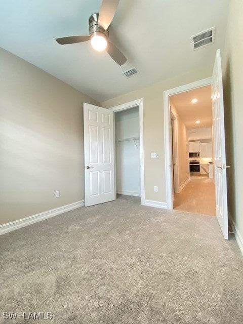 1023 Enbrook Loop, Naples, FL 34114 - unfurnished bedroom with carpet flooring, a ceiling fan, and a closet