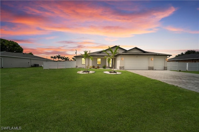 1421 SW 13th Ter, Cape Coral, FL 33991 - ranch-style house with an attached garage, decorative driveway, stucco siding, and stone siding