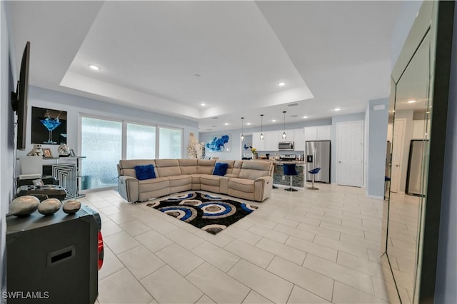 1421 SW 13th Ter, Cape Coral, FL 33991 - living area featuring a tray ceiling, recessed lighting, and light tile patterned flooring