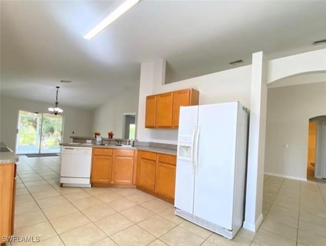 4839 18th St NE Unit 1, Naples, FL 34120 - kitchen with white appliances, arched walkways, light tile patterned flooring, a peninsula, and lofted ceiling