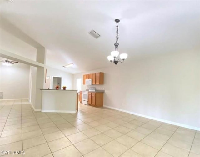 4839 18th St NE Unit 1, Naples, FL 34120 - unfurnished living room with light tile patterned flooring, a chandelier, and lofted ceiling