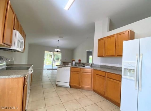 4839 18th St NE Unit 1, Naples, FL 34120 - kitchen with white appliances, brown cabinets, light tile patterned floors, a peninsula, and decorative light fixtures