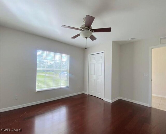 4839 18th St NE Unit 1, Naples, FL 34120 - unfurnished room featuring wood finished floors and a ceiling fan