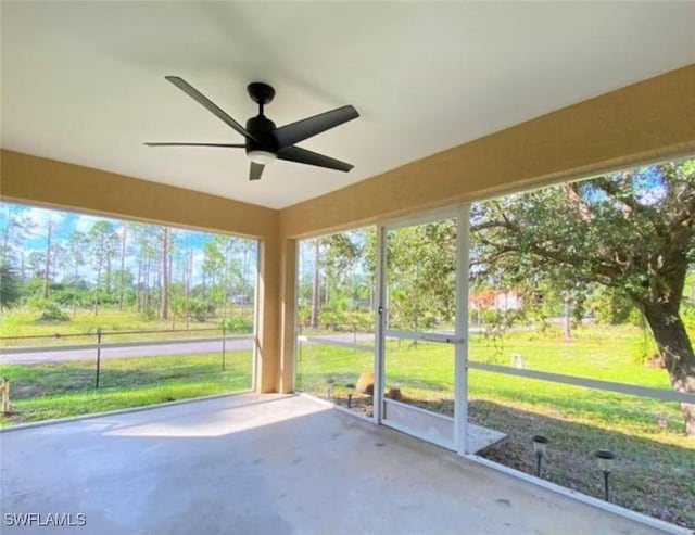 4839 18th St NE Unit 1, Naples, FL 34120 - unfurnished sunroom featuring a ceiling fan