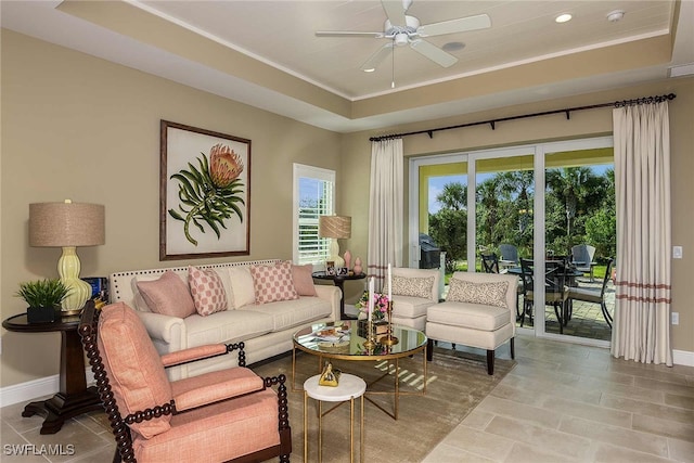 4088 Pegasus Way, Naples, FL 34120 - tiled living area featuring a ceiling fan, ornamental molding, recessed lighting, and a tray ceiling