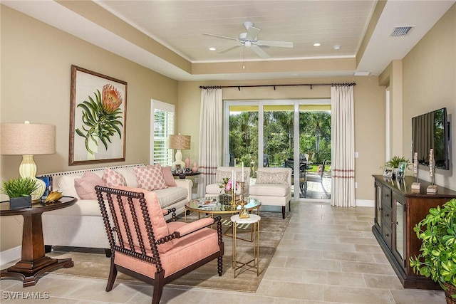 4088 Pegasus Way, Naples, FL 34120 - living room featuring a ceiling fan, a tray ceiling, and recessed lighting