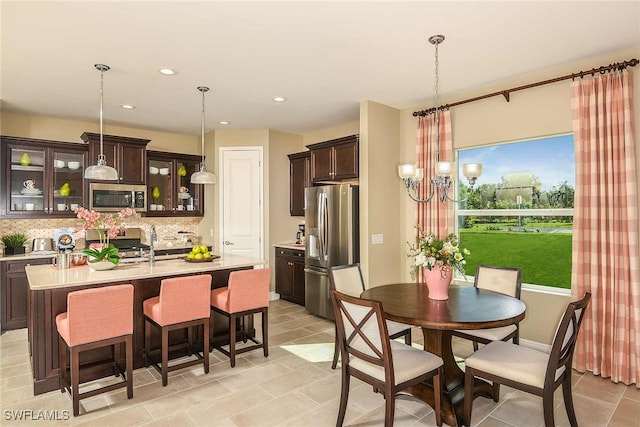 4088 Pegasus Way, Naples, FL 34120 - dining room featuring a chandelier, recessed lighting, and light tile patterned floors