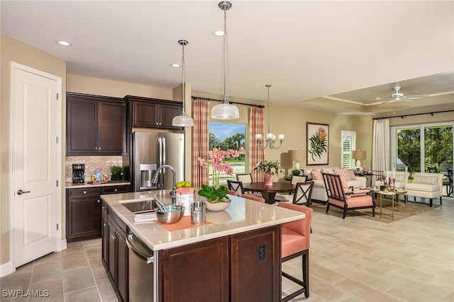 4088 Pegasus Way, Naples, FL 34120 - kitchen with stainless steel refrigerator with ice dispenser, dark brown cabinets, a ceiling fan, decorative light fixtures, and recessed lighting