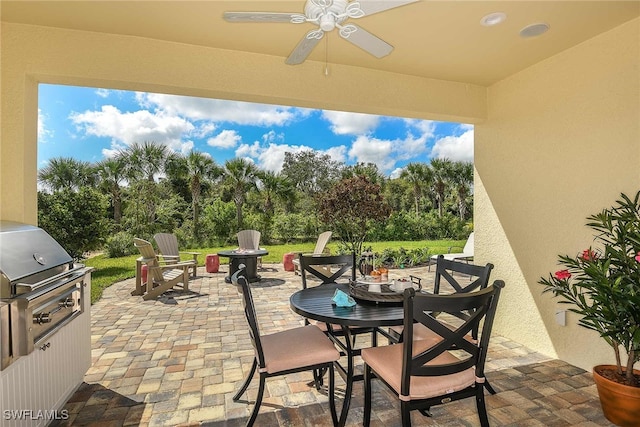 4088 Pegasus Way, Naples, FL 34120 - view of patio / terrace with outdoor dining area, a fire pit, a ceiling fan, view of scattered trees, and area for grilling
