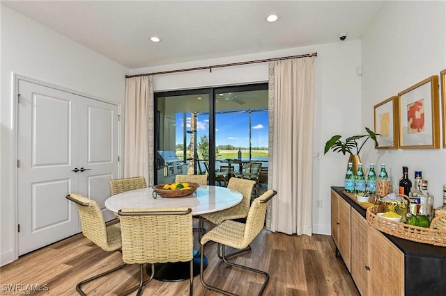 4563 Centaurus Cir, Naples, FL 34120 - dining area with wood finished floors, recessed lighting, and a bar