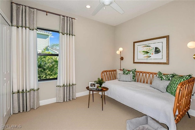4563 Centaurus Cir, Naples, FL 34120 - bedroom featuring carpet flooring, multiple windows, and a ceiling fan