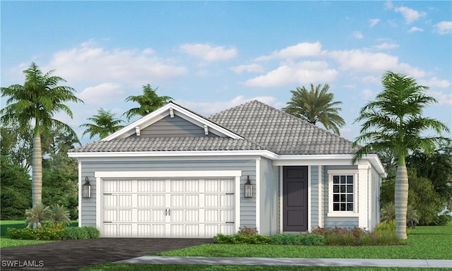 4577 Centaurus Cir, Naples, FL 34120 - view of front of home with a tiled roof, a garage, and driveway