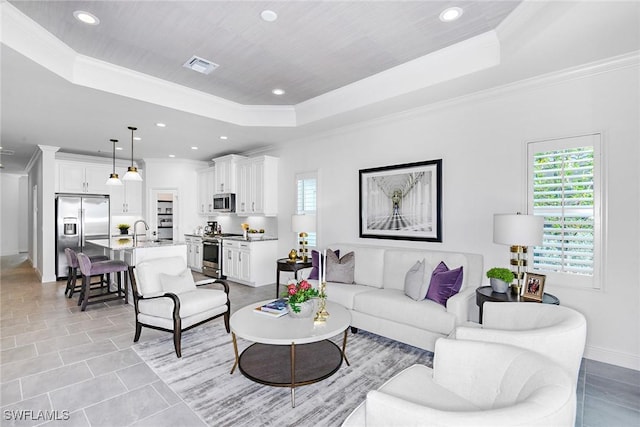 4577 Centaurus Cir, Naples, FL 34120 - living area with a raised ceiling, crown molding, recessed lighting, and light tile patterned floors