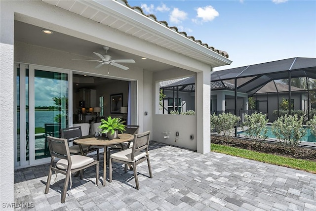 4577 Centaurus Cir, Naples, FL 34120 - view of patio with a ceiling fan, a lanai, and outdoor dining space