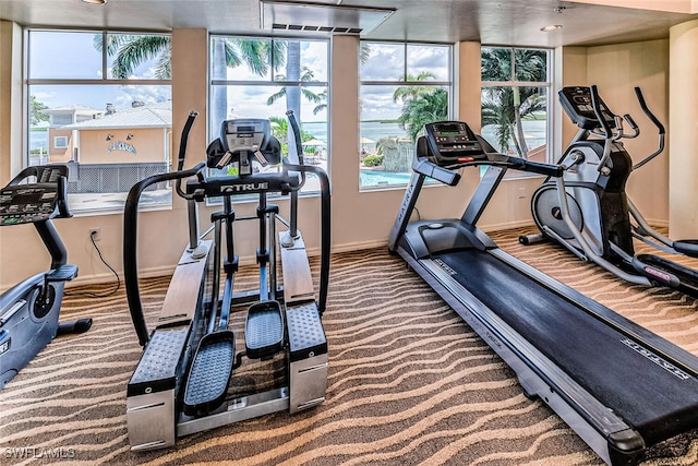 8771 Estero Blvd Unit 406, Fort Myers Beach, FL 33931 - workout area featuring baseboards and carpet floors