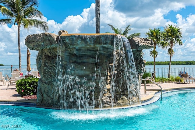 8771 Estero Blvd Unit 406, Fort Myers Beach, FL 33931 - community pool featuring a patio and a water view