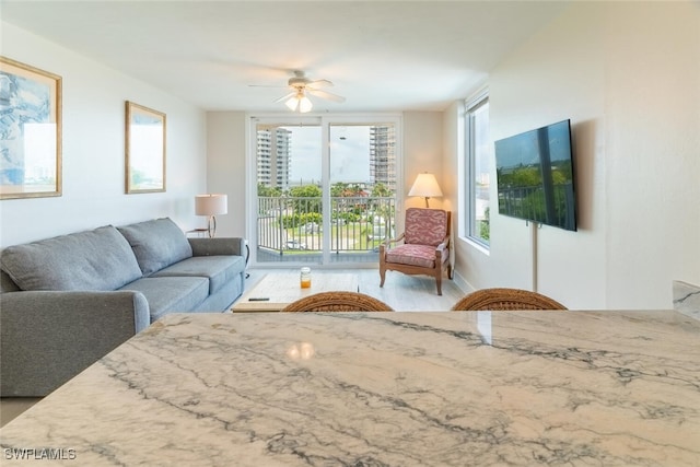 8771 Estero Blvd Unit 406, Fort Myers Beach, FL 33931 - living area with a ceiling fan, healthy amount of natural light, and wood finished floors