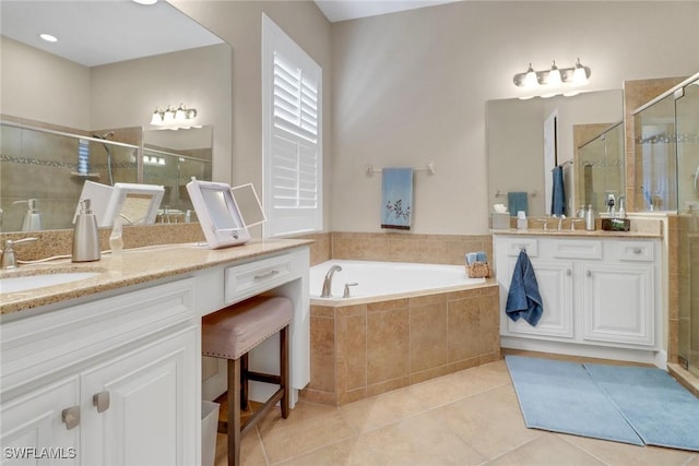 14642 Speranza Way, Bonita Springs, FL 34135 - full bathroom featuring two vanities, a stall shower, tile patterned flooring, and a garden tub