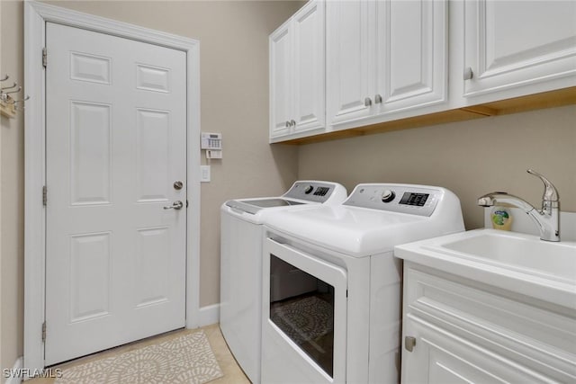 14642 Speranza Way, Bonita Springs, FL 34135 - laundry room featuring washing machine and dryer and cabinet space