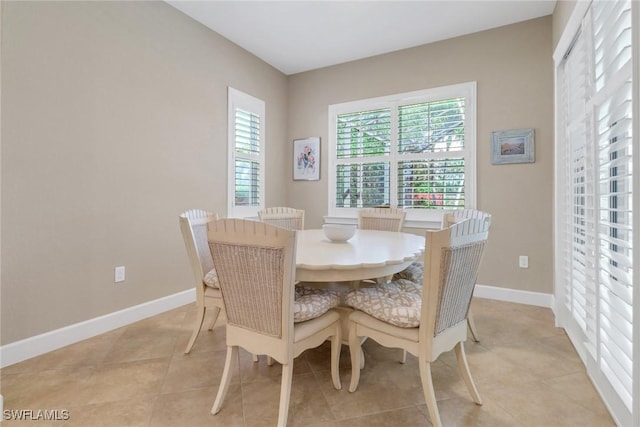 14642 Speranza Way, Bonita Springs, FL 34135 - dining room featuring light tile patterned floors