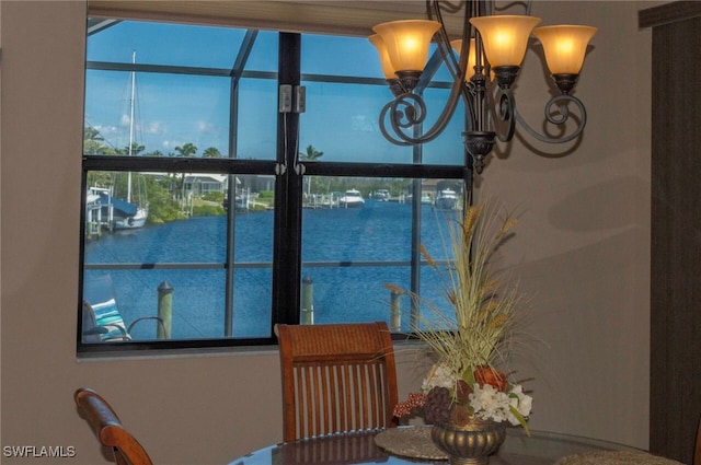 3606 Whippoorwill Blvd, Punta Gorda, FL 33950 - dining space featuring a chandelier