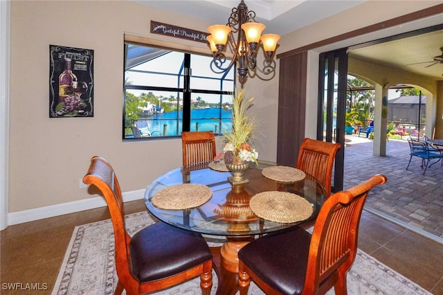 3606 Whippoorwill Blvd, Punta Gorda, FL 33950 - dining room with a chandelier and ceiling fan
