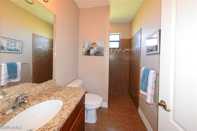 3606 Whippoorwill Blvd, Punta Gorda, FL 33950 - bathroom featuring vanity, a walk in shower, and tile patterned floors