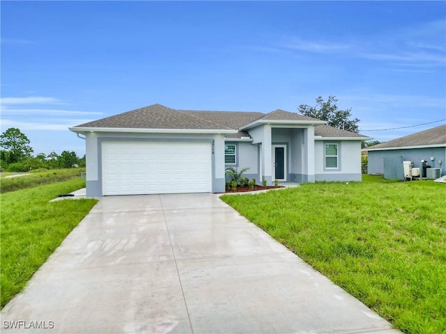 2718 42nd St W, Lehigh Acres, FL 33971 - view of front of house featuring stucco siding, a garage, a front lawn, and concrete driveway