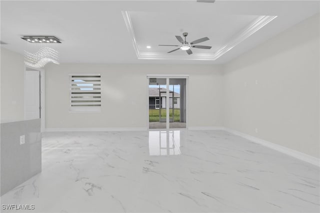 2718 42nd St W, Lehigh Acres, FL 33971 - spare room with ornamental molding, a raised ceiling, plenty of natural light, a ceiling fan, and marble finish floors