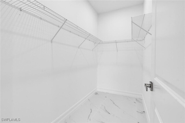 2718 42nd St W, Lehigh Acres, FL 33971 - spacious closet with marble look tile flooring