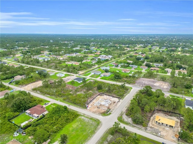 2718 42nd St W, Lehigh Acres, FL 33971 - aerial overview of property's location with nearby suburban area