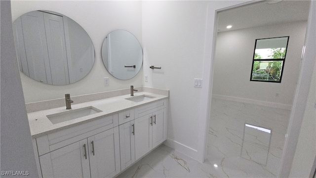 3124 40th St SW, Lehigh Acres, FL 33976 - bathroom with marble finish floors, double vanity, and recessed lighting