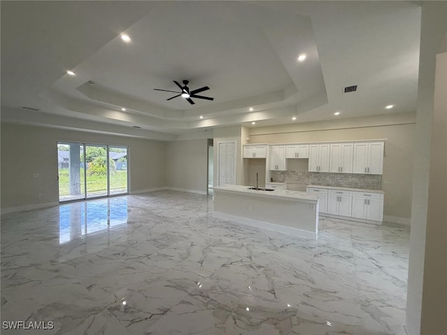 6050 Langdon Ave, Fort Myers, FL 33905 - unfurnished living room featuring a tray ceiling, recessed lighting, and ceiling fan