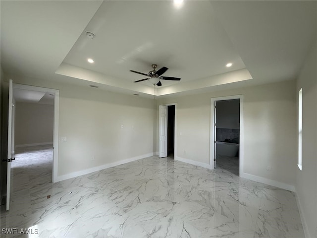 6050 Langdon Ave, Fort Myers, FL 33905 - unfurnished bedroom with a tray ceiling, light marble finish flooring, recessed lighting, and a ceiling fan