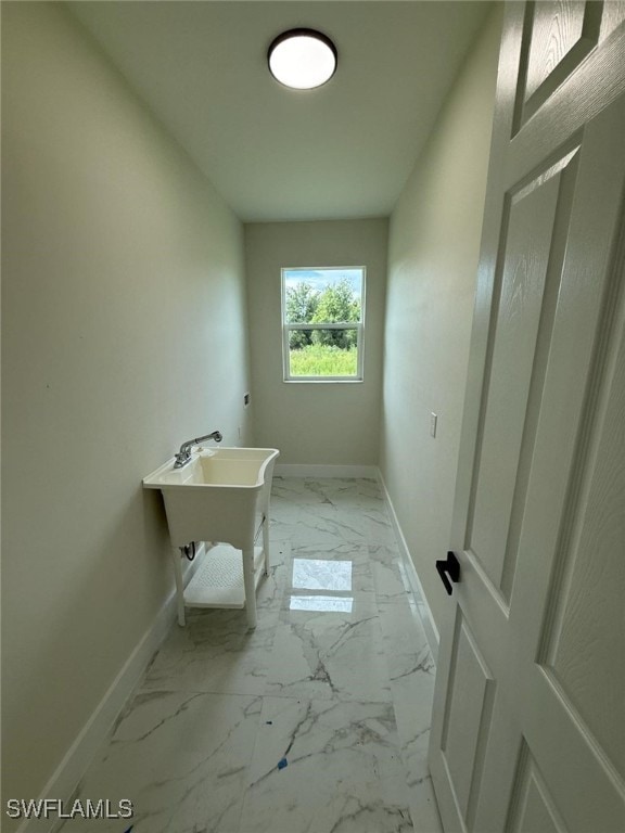 6050 Langdon Ave, Fort Myers, FL 33905 - bathroom with baseboards and marble look tiles