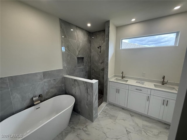 6050 Langdon Ave, Fort Myers, FL 33905 - bathroom featuring a walk in shower, a freestanding tub, recessed lighting, marble finish floors, and double vanity