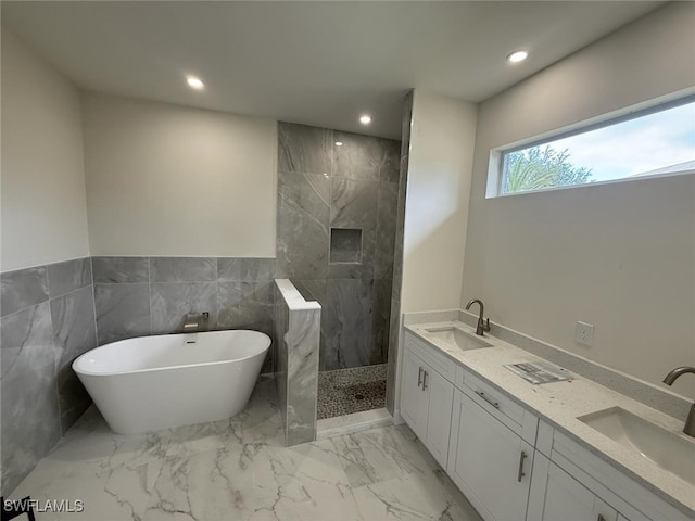 6050 Langdon Ave, Fort Myers, FL 33905 - full bathroom with a freestanding bath, recessed lighting, a marble finish shower, marble finish floors, and double vanity